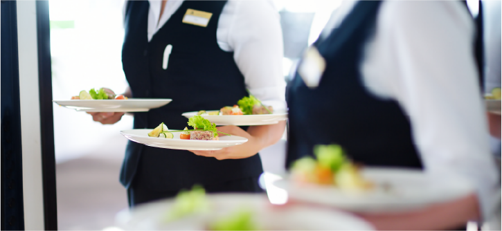 Waiters carrying food